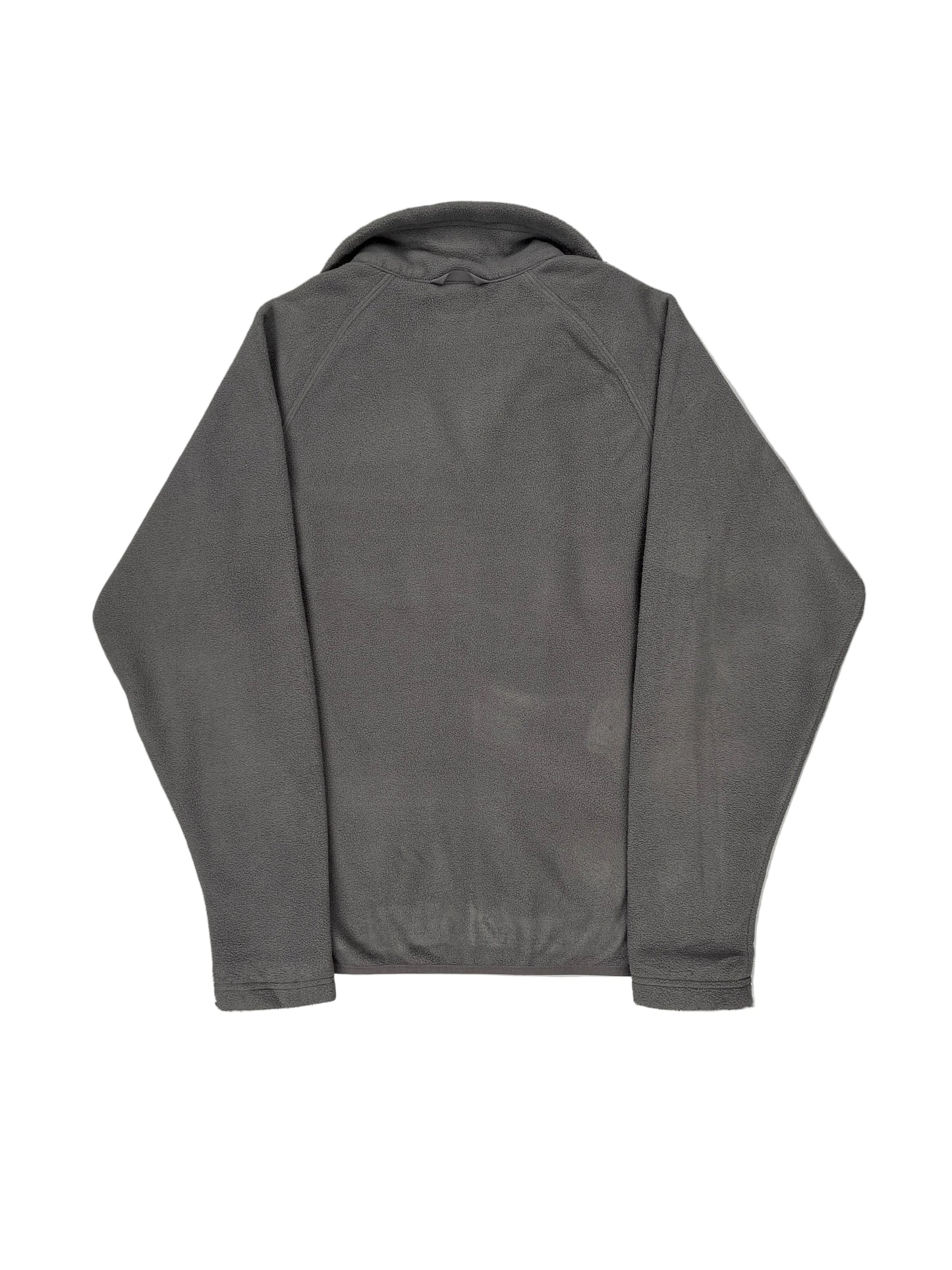 Folded gray pants on a white surface Folded gray pants on a white surface