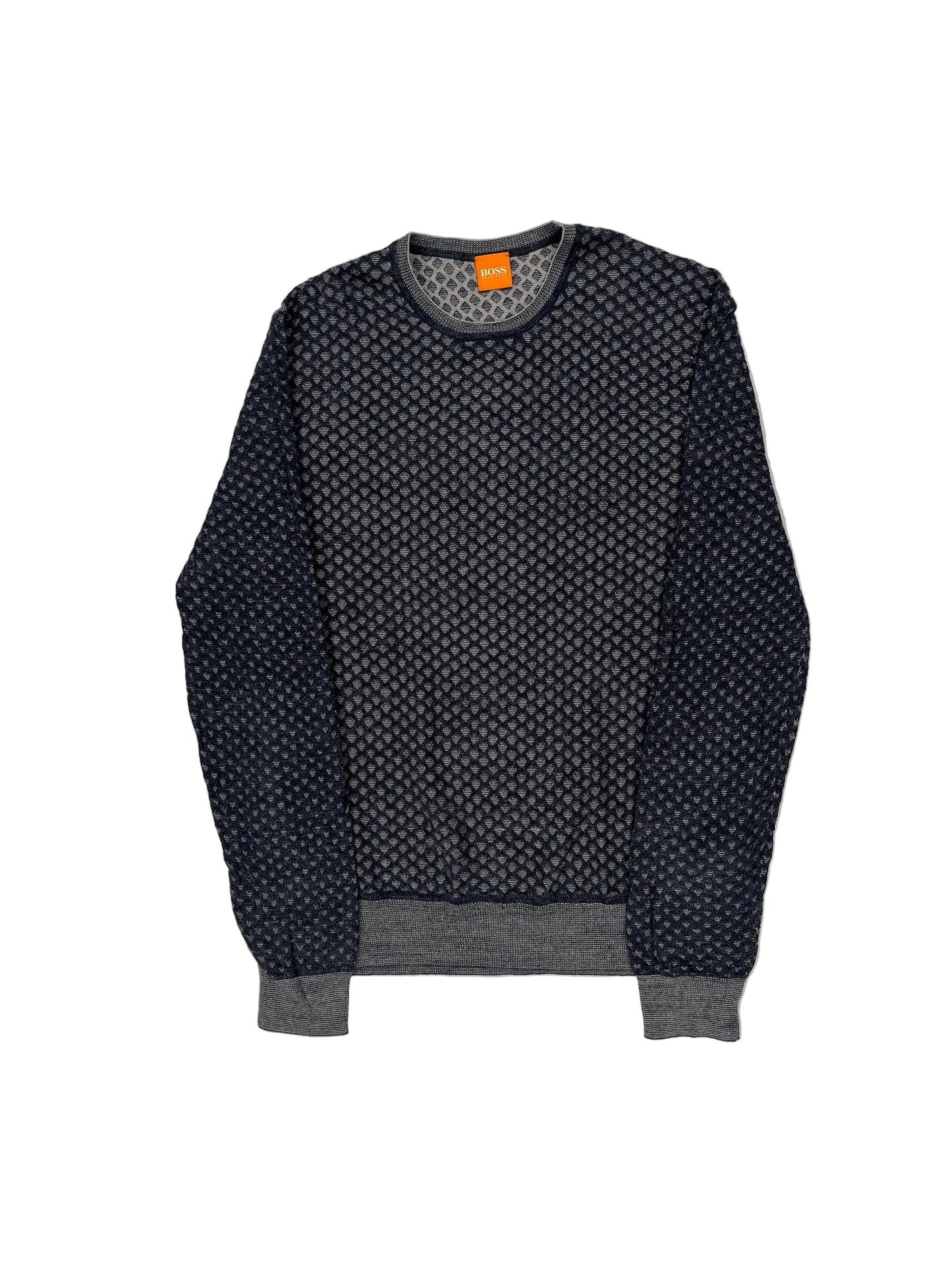 Black patterned sweater with an orange tag on a white background Black patterned sweater with an orange tag on a white background