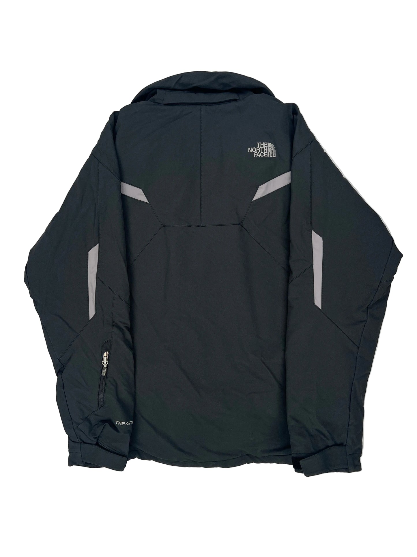 Folded black jacket with visible branding on a light gray background Folded black jacket with visible branding on a light gray background