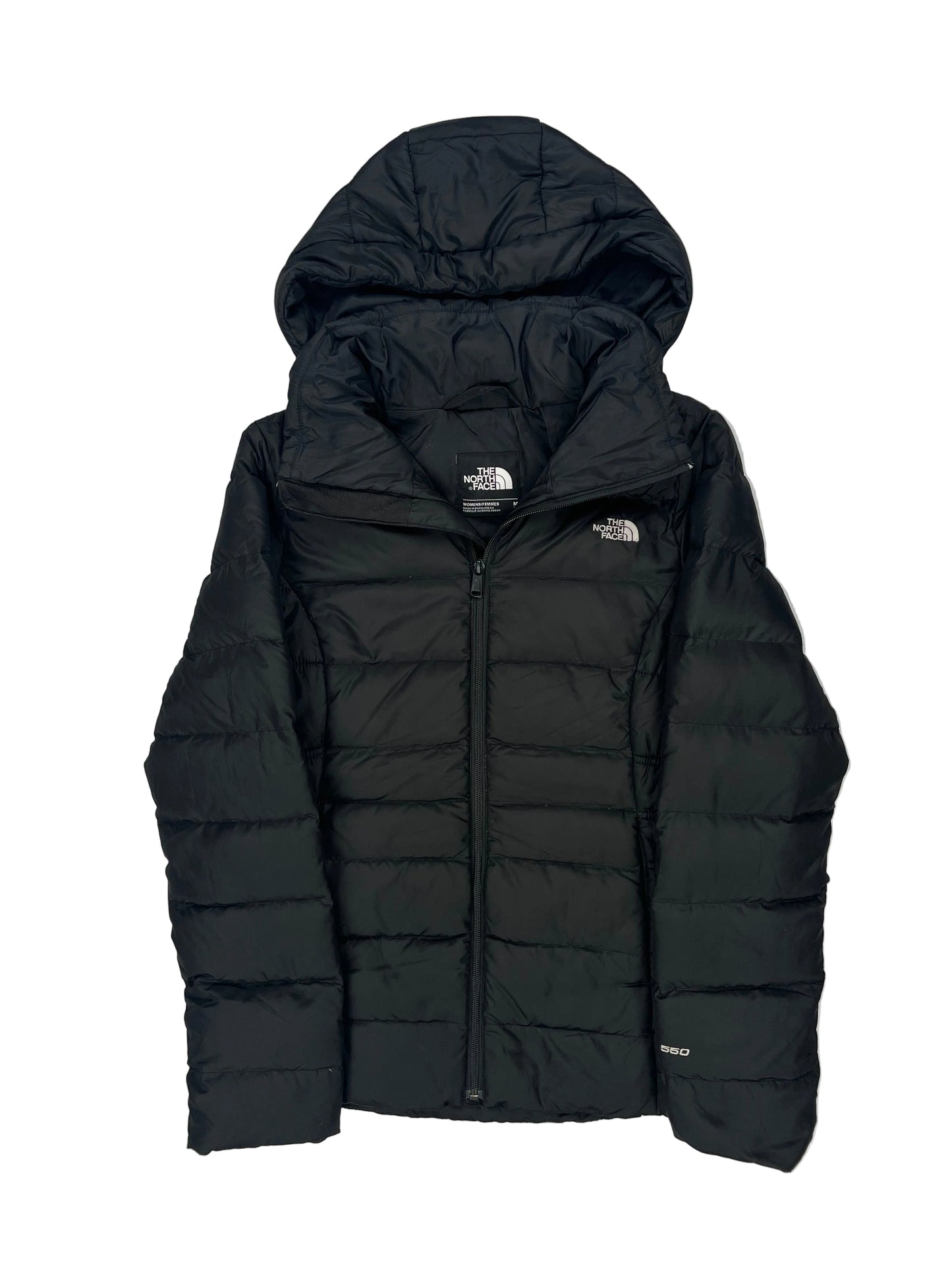 Folded black puffer jacket on a white background Folded black puffer jacket on a white background