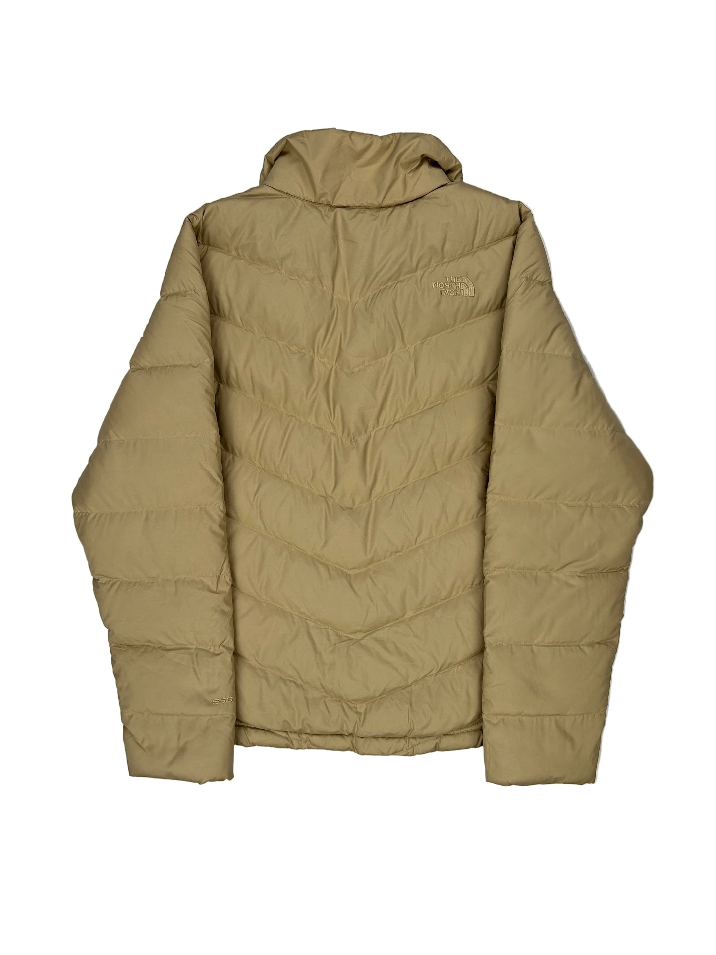 Folded beige puffer jacket on a white background Folded beige puffer jacket on a white background