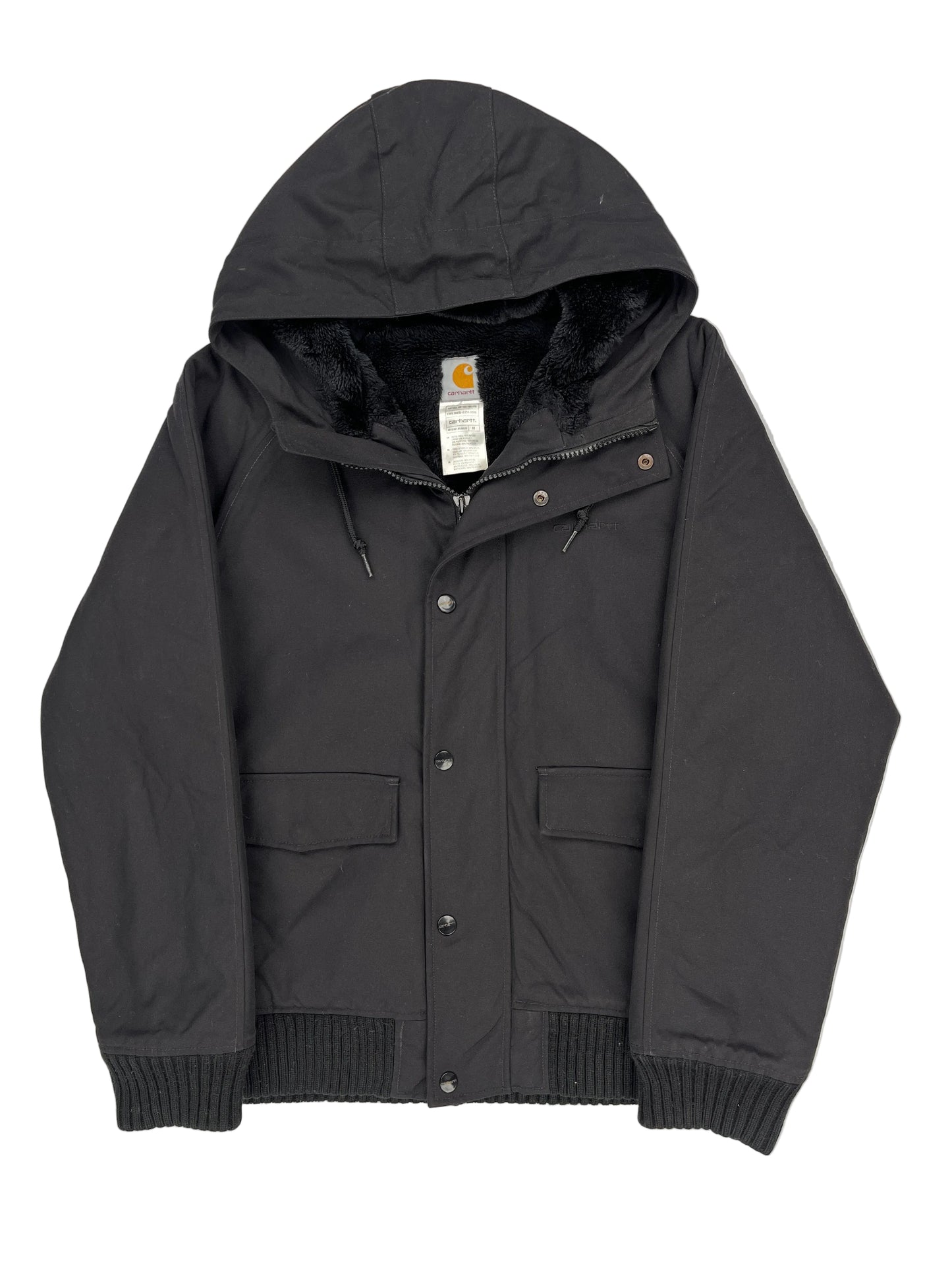 Folded black jacket on a white background