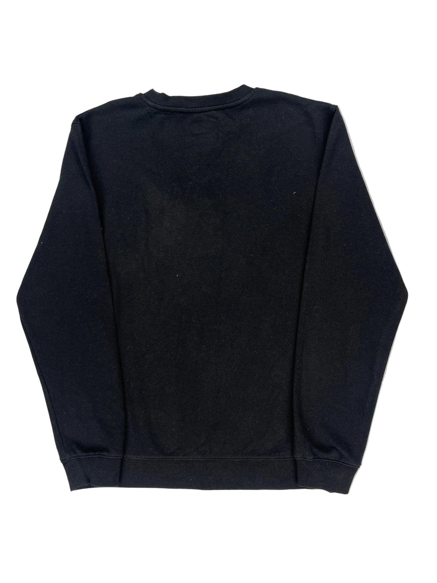 Folded black shirt on a white background