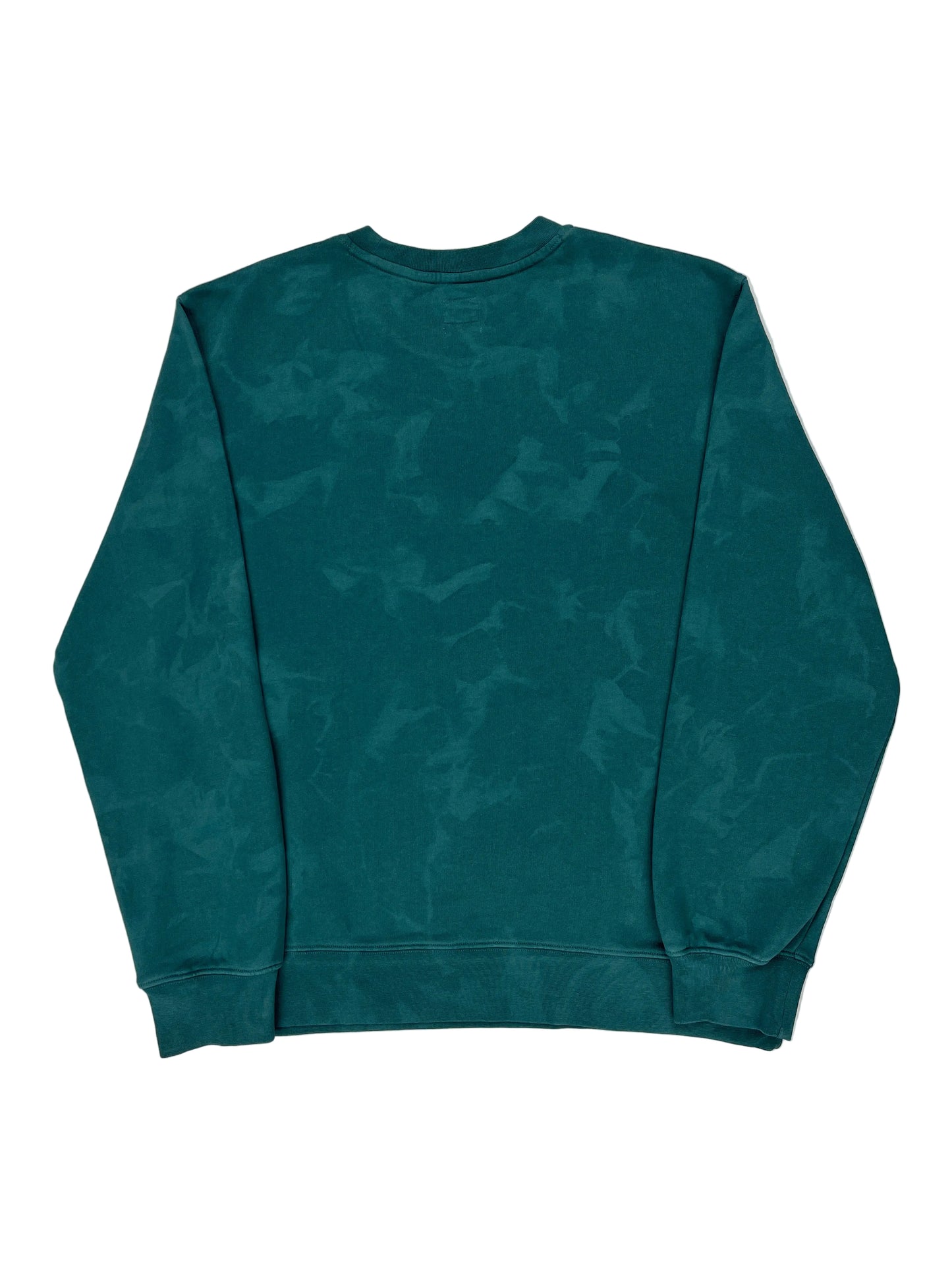 Teal camouflage-patterned shirt on a white background