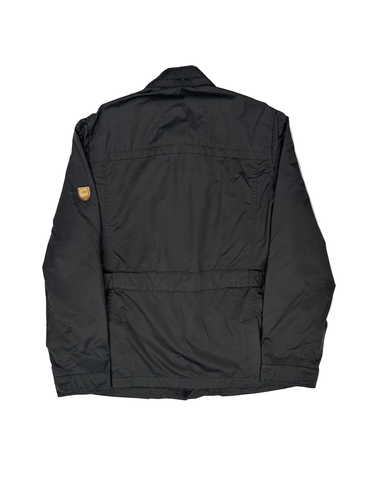 Folded black jacket on a white background