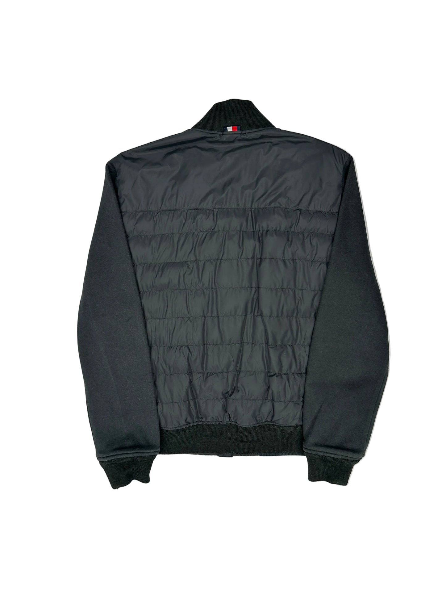 Black quilted jacket on a white mannequin against a gray background