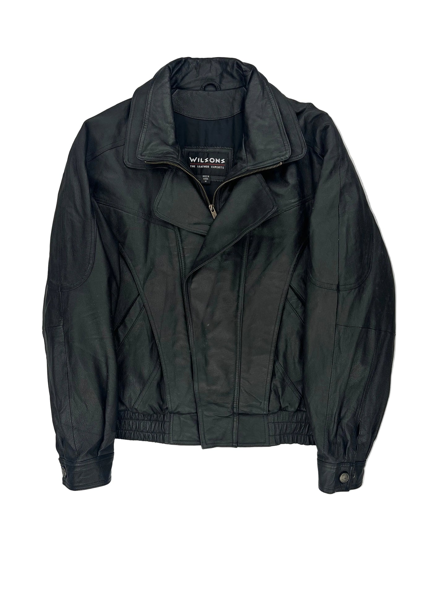 Folded black jacket on a white background