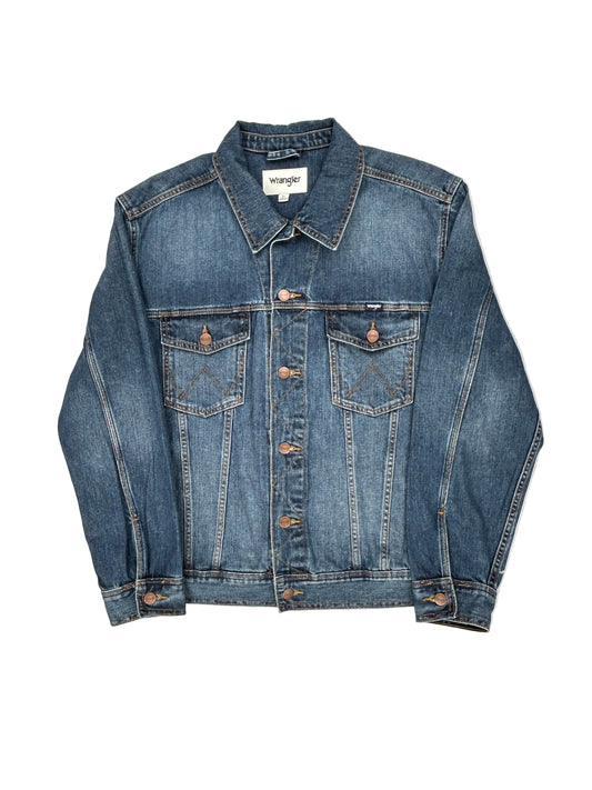 Folded blue denim jacket on a white background