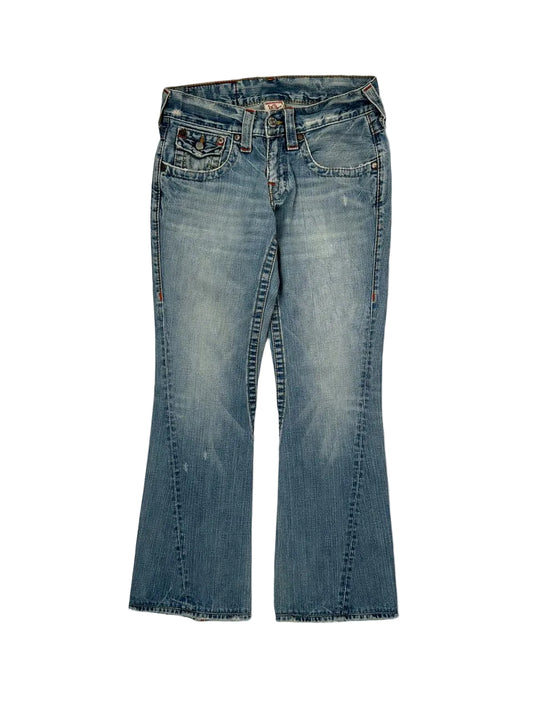 Pair of blue jeans on a light gray background